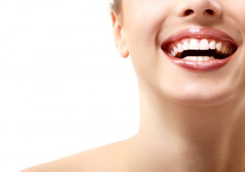 Closeup of woman with white teeth smiling