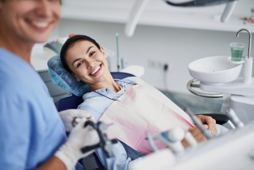 Dentist and Patient Smiling