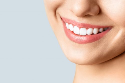 Closeup of woman with white teeth smiling